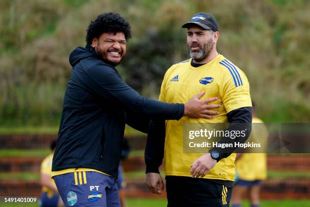Pasilio Tosi enjoys a laugh with Set-piece Coach Jamie Mackintosh during a Hurricanes Super Rugby captain's run at Rugby League Park on May 19, 2023...