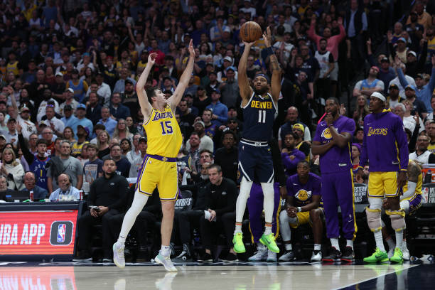 Bruce Brown of the Denver Nuggets shoots against Austin Reaves of the Los Angeles Lakers during the fourth quarter in game two of the Western...