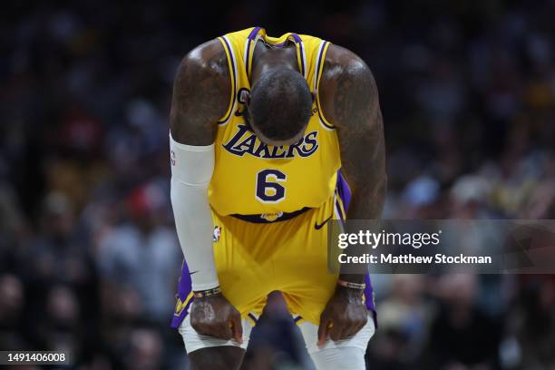 LeBron James of the Los Angeles Lakers reacts after losing to the Denver Nuggets in game two of the Western Conference Finals at Ball Arena on May...