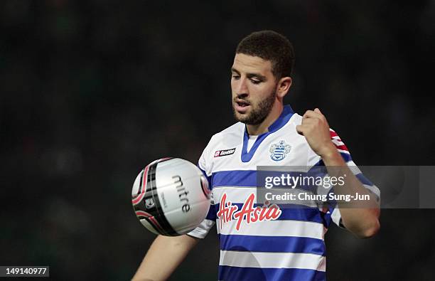 Adel Taarabt reacts during the preseason friendly match between Persebaya and Queens Park Rangers at Gelora Bung Tomo Stadium on July 23, 2012 in...