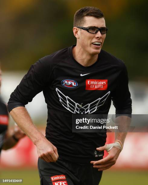 Mason Cox of the Magpies looks on during a Collingwood Magpies AFL training session at Olympic Park Oval on May 19, 2023 in Melbourne, Australia.