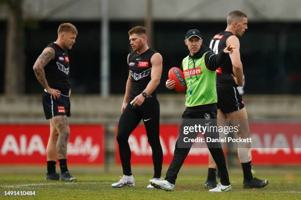 Magpies head coach Craig McRae in action during a Collingwood Magpies AFL training session at Olympic Park Oval on May 19, 2023 in Melbourne,...