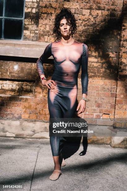 An off-duty model wears a Jean Paul Gaultier naked dress and Bloch ballet flats at Afterpay Australian Fashion Week 2023 at Carriageworks on May 19,...