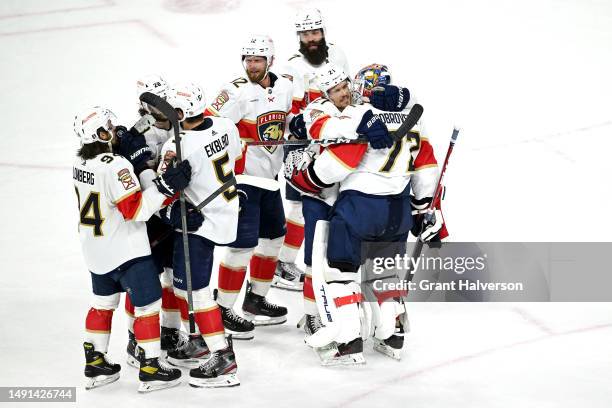 Nick Cousins and Sergei Bobrovsky of the Florida Panthers hug after defeating the Carolina Hurricanes in fourth overtime in Game One of the Eastern...