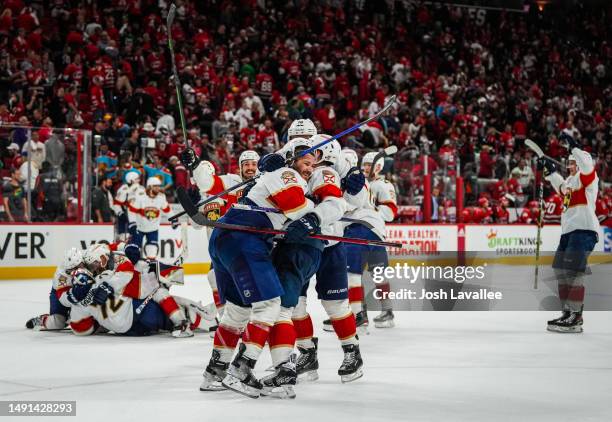 Matthew Tkachuk of the Florida Panthers celebrates with teammates after scoring the game-winning goal during the fourth overtime to defeat the...