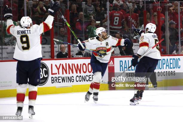 Matthew Tkachuk of the Florida Panthers celebrates with his teammates after scoring the game winning goal on Frederik Andersen of the Carolina...