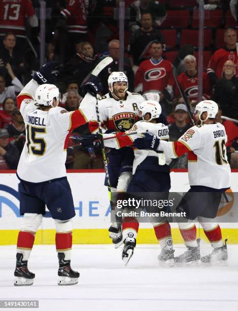 Matthew Tkachuk of the Florida Panthers celebrates with his teammates after scoring the game winning goal on Frederik Andersen of the Carolina...