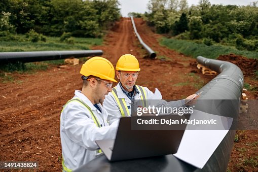 Engineers checking construction site Engineers checking construction site