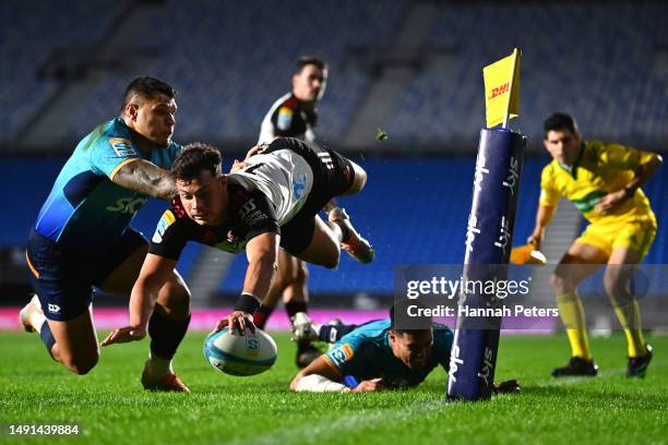 Macca Springer of the Crusaders dives over to score a try during the round 13 Super Rugby Pacific match between Moana Pasifika and Crusaders at Mt...