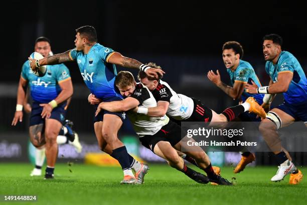 Levi Aumua of Moana Pasifika makes a break during the round 13 Super Rugby Pacific match between Moana Pasifika and Crusaders at Mt Smart Stadium, on...