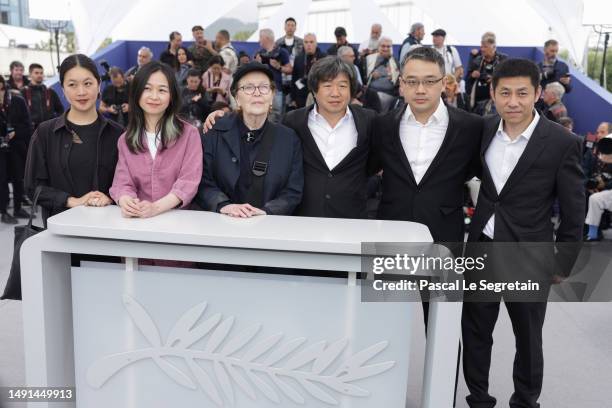 Liyo Gong, Bingyuan Xu, Dominique Auvray, Director Wang Bing, Maeda Yoshitaka and Liu Xianhui attend the "Jeunesse " photocall at the 76th annual...