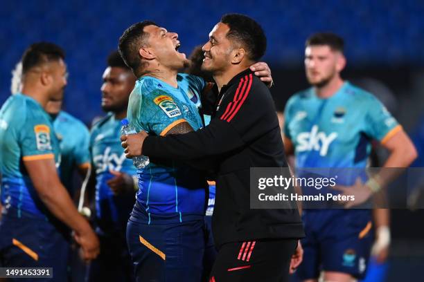 Levi Aumua of Moana Pasifika hugs Sione Havili of the Crusaders following the round 13 Super Rugby Pacific match between Moana Pasifika and Crusaders...