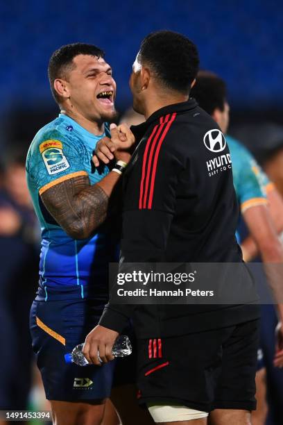 Levi Aumua of Moana Pasifika hugs Sione Havili of the Crusaders following the round 13 Super Rugby Pacific match between Moana Pasifika and Crusaders...