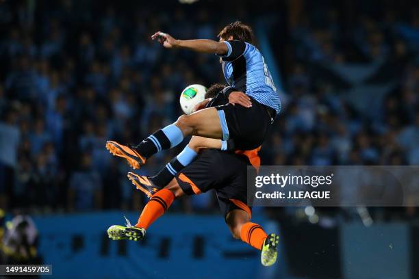 Yoshito Okubo of Kawasaki Frontale and Hideki Ishige of Shimizu S-Pulse compete for the ball during the J.League J1 match between Kawasaki Frontale...