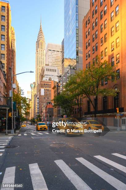 yellow taxis on manhattan streets, new york city - ny stock pictures, royalty-free photos & images