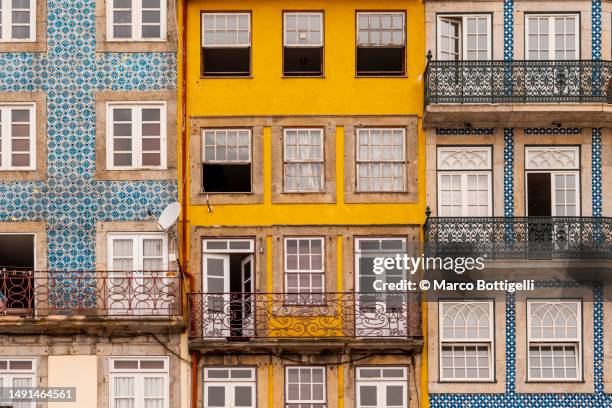 colorful row houses in ribeira district, porto, portugal - porto portugal stockfoto's en -beelden