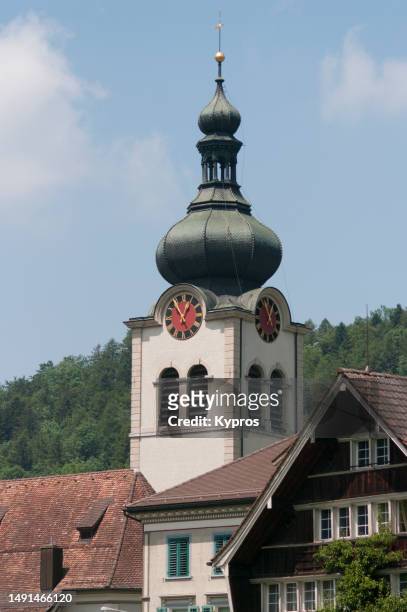 church with spire - switzerland - pinnacle stockfoto's en -beelden