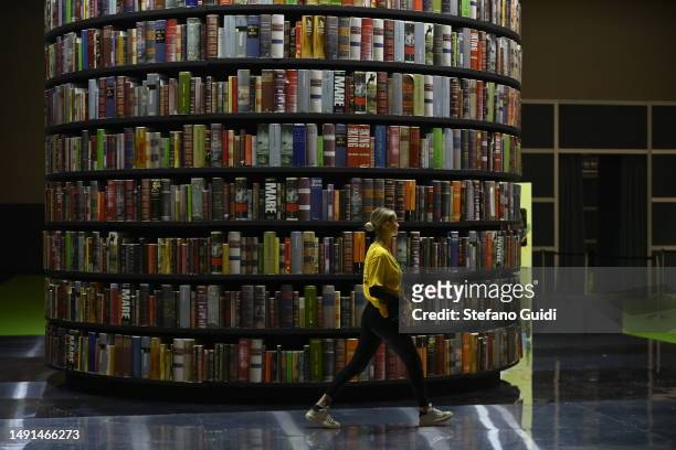 Person walks near a book tower during the Turin Book Fair 2023 on May 19, 2023 in Turin, Italy. The Turin International Book Fair is the largest book...