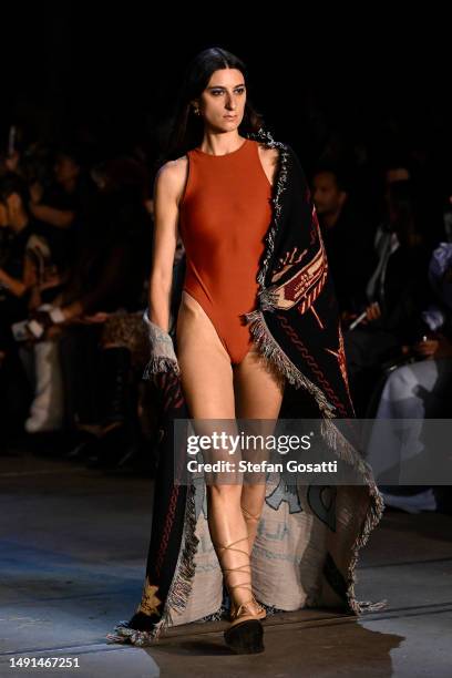 Model walks the runway during the We Wear Australian x Afterpay - Runway show during Afterpay Australian Fashion Week 2023 at Carriageworks on May...
