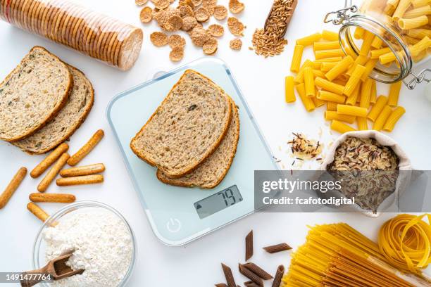 weighting carbohydrates with kitchen scale - serving size stock pictures, royalty-free photos & images