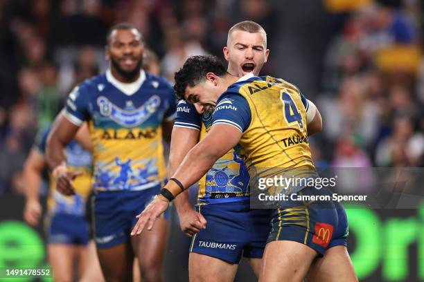 Bailey Simonsson of the Eels celebrates scoring a try with Brendan Hands of the Eels during the round 12 NRL match between South Sydney Rabbitohs and...