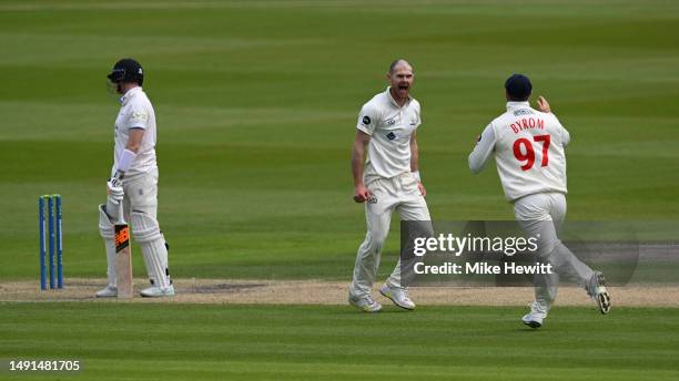 Bowler James Harris of Glamorgan celebrates with team mate Eddie Byrom after dismissing Steve Smith of Sussex during the LV= Insurance County...