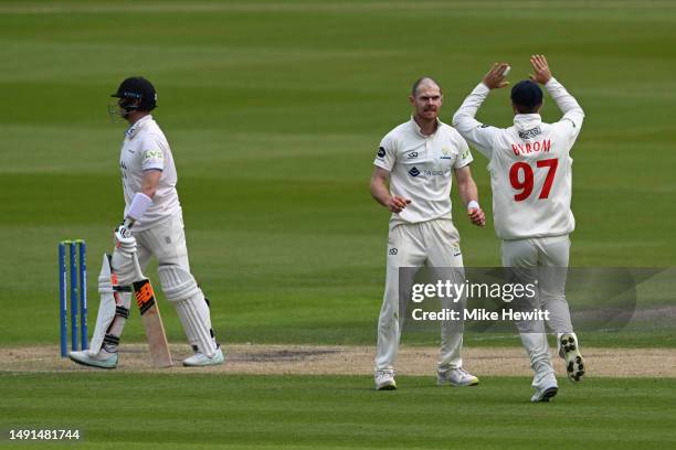 Bowler James Harris of Glamorgan celebrates with team mate Eddie Byrom after dismissing Steve Smith of Sussex during the LV= Insurance County...