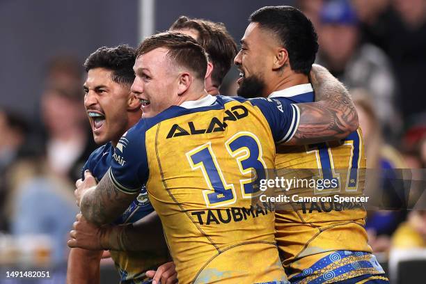 Dylan Brown of the Eels celebrates scoring a try with team mates during the round 12 NRL match between South Sydney Rabbitohs and Parramatta Eels at...
