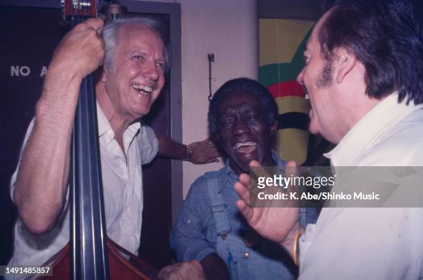 Bob Haggart, Art Blakey and George Wein talk together smiling, Newport Jazz Festival at The Hudson Boat Ride, New York, United States, 3 July 1976