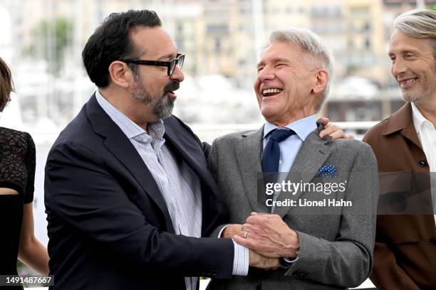 Director James Mangold and Harrison Ford attend the "Indiana Jones And The Dial Of Destiny" photocall at the 76th annual Cannes film festival at...