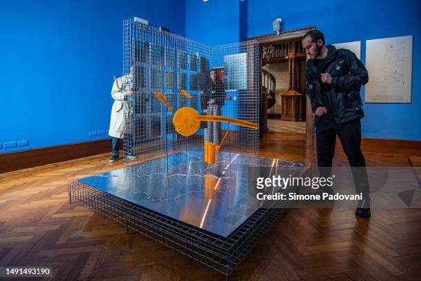 Visitors attend the press preview at the Portugal national pavilion "FERTILE FUTURES" curated by Andreia Garcia during the 18th International...