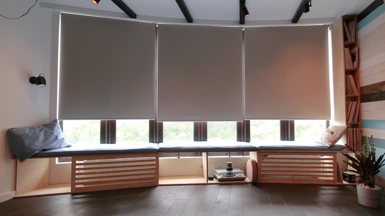 https://media.gettyimages.com/id/1491498945/video/automatic-roller-blinds-beige-color-close-down-on-big-glass-windows.jpg?b=1&s=640x640&k=20&c=MamJSRpetxZFtWJghInh7WKus9d2Vfqs8sVHSdTysf8=