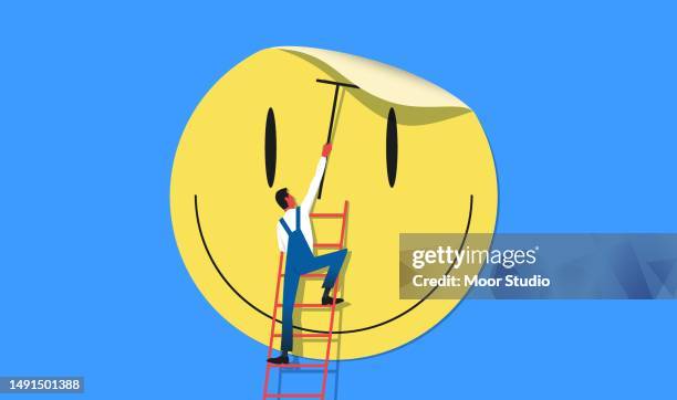 man putting giant smile sticker on the wall vector illustration - putter cartoon stock illustrations