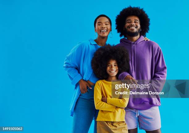 shot of a young couple with their son standing whilst smiling and looking into the camera wearing casual clothing with copy space, stock photo - boy yellow shirt stock pictures, royalty-free photos & images