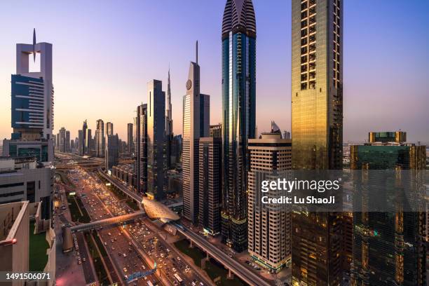 aerial view of cityscape at sunset in dubai uae - united arab emirates aerial stock pictures, royalty-free photos & images