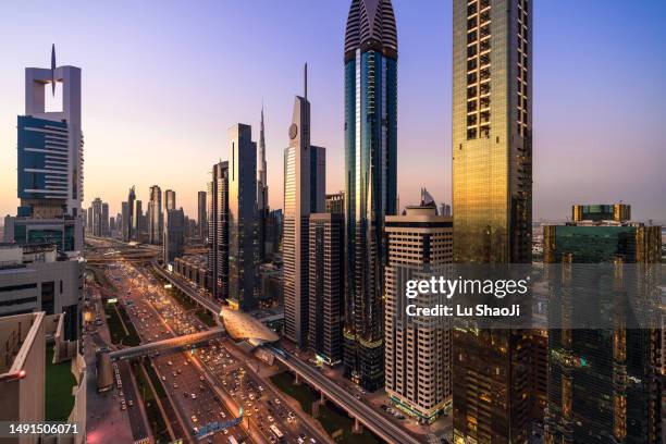 aerial view of cityscape at sunset in dubai uae - dubai stock pictures, royalty-free photos & images