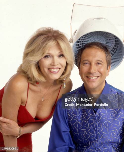 The singer, actress, television presenter and French model naturalized British Amanda Lear and the TV host Marco Balestri, pose for a photo shoot for...