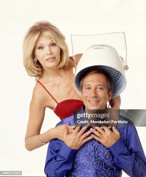 The singer, actress, television presenter and French model naturalized British Amanda Lear and the TV host Marco Balestri, pose for a photo shoot for...