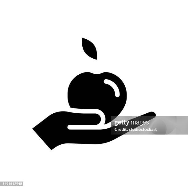 hand with apple flat design - cutting green apple stock illustrations