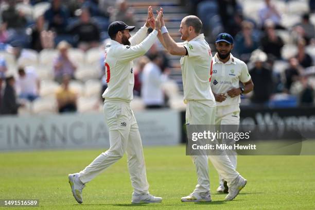 James Harris of Glamorgan celebrates with team mate Michael Neser after dismissing James Coles of Sussex during the LV= Insurance County Championship...