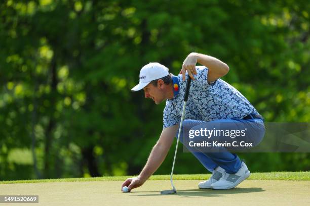 Justin Rose of England lines up a putt on the 14th green during the second round of the 2023 PGA Championship at Oak Hill Country Club on May 19,...