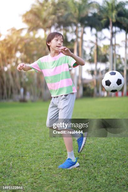 boy practicing soccer skill - soccer training grounds stock pictures, royalty-free photos & images