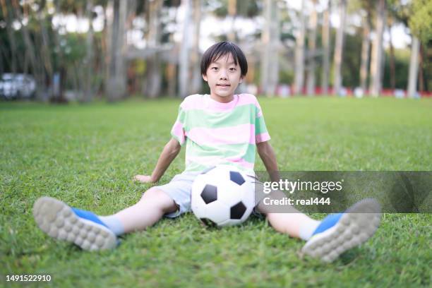 boy practicing soccer skill - soccer training grounds stock pictures, royalty-free photos & images