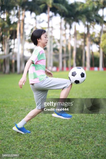 boy practicing soccer skill - soccer training grounds stock pictures, royalty-free photos & images