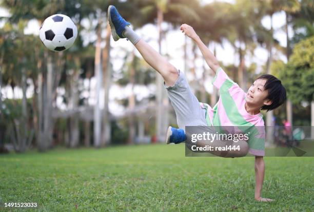 boy practicing soccer skill - all people stock pictures, royalty-free photos & images