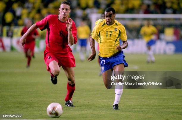 June 2002, Kobe - FIFA World Cup 2nd round - Brazil v Belgium - Timmy Simons of Belgium and Denilson of Brazil.