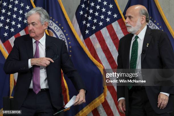 Federal Reserve Chairman Jerome Powell and former Chairman Ben Bernanke depart after speaking at the Thomas Laubach Research Conference on “key...