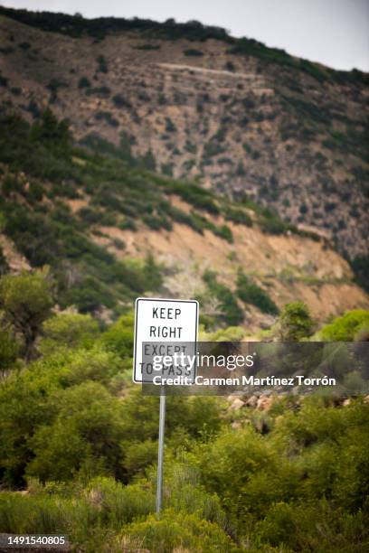 'keep right except to pass' in arches national park, utah, usa. - utah flag stock pictures, royalty-free photos & images