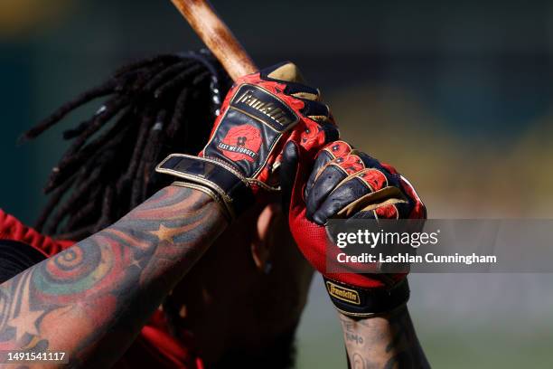 Detail shot of the gloves worn by Ketel Marte of the Arizona Diamondbacks during warm up before the game against the Oakland Athletics at RingCentral...