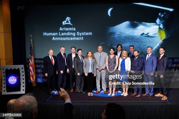 The teams from Blue Origin and the National Aeronautics and Space Administration, including administrator Bill Nelson pose for a photograph following...
